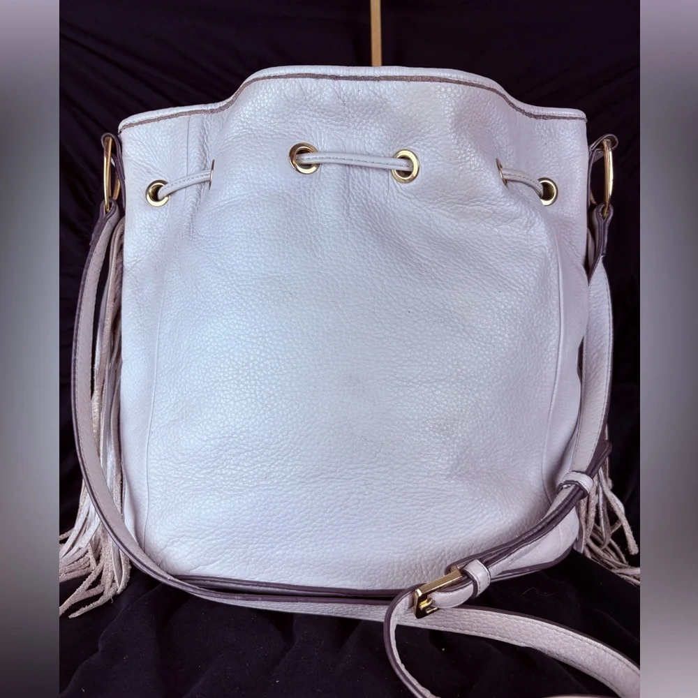 G.I.L.I. Got It. Love It. White Pebbled Leather Drawstring Hobo Tassel